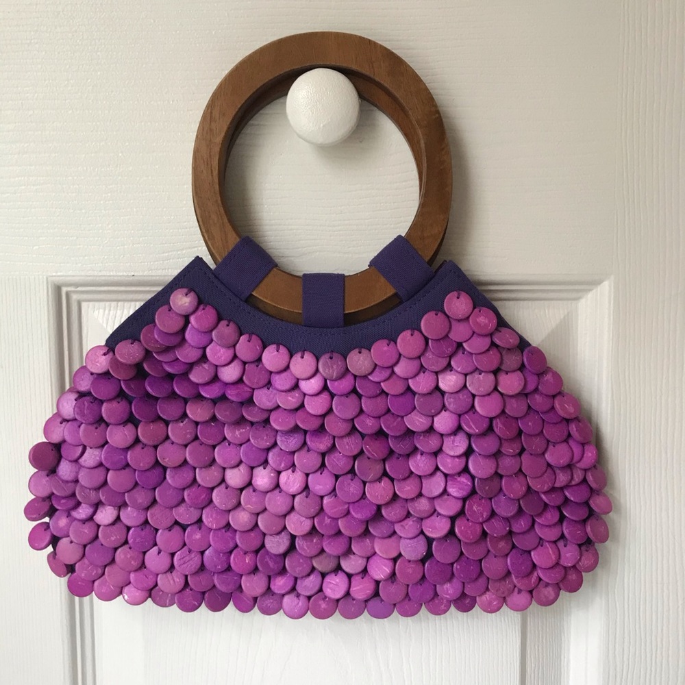 small purple and wood Hype purse